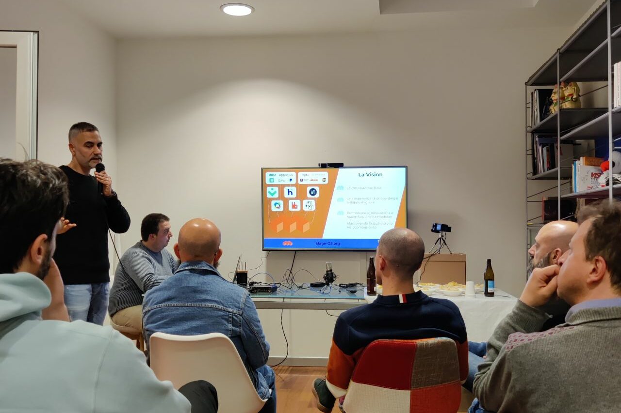 Alessandro Ronchi speaking at a PHP User Group Romagna meetup to present Mage-OS